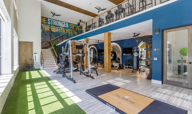 Fitness center with equipment and natural light 
